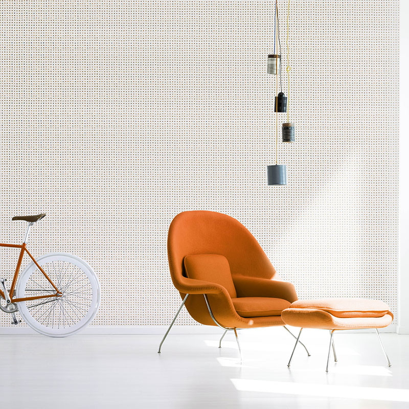 Red bicycle and armchair under lamp in white minimal apartment i