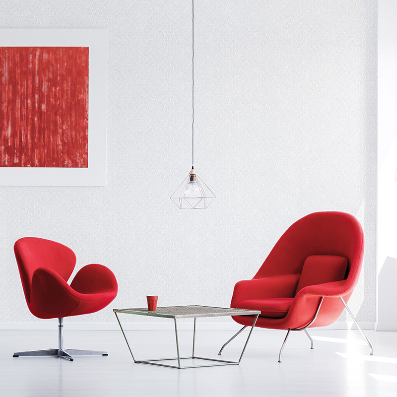 Designer red armchairs at table